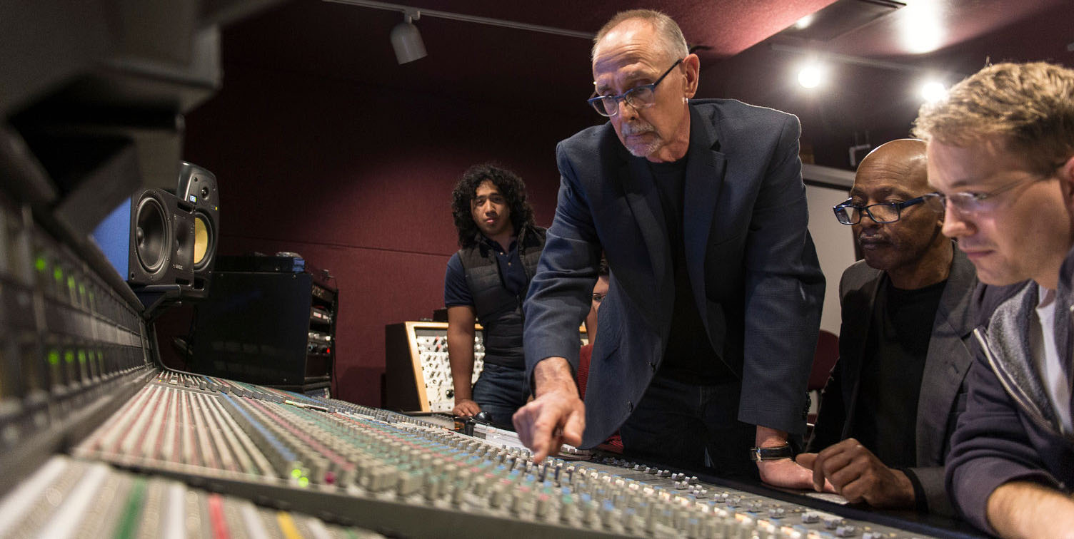 Audio Engineering instructor and student working control board